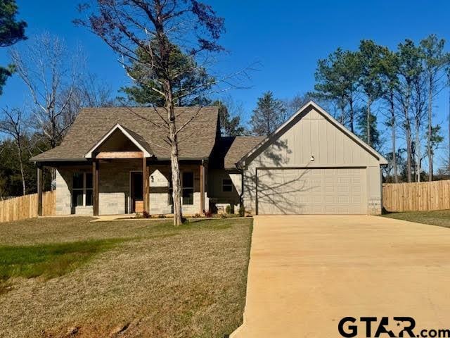 view of front facade with a garage and a front yard