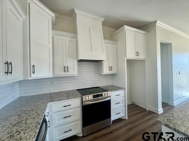 kitchen with white cabinetry, stainless steel appliances, and tasteful backsplash