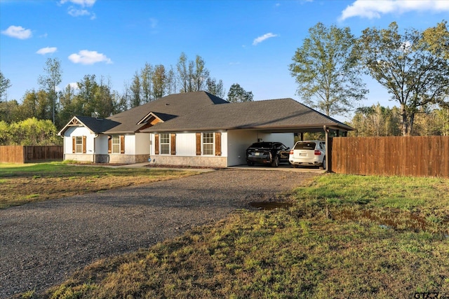 single story home featuring a carport