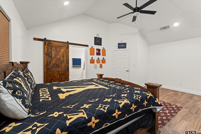 bedroom with a tray ceiling, ceiling fan, and dark hardwood / wood-style flooring