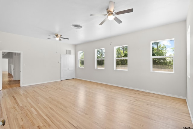 4456 Fm 2767, Tyler, TX 75708 - unfurnished living room with light wood-style floors, visible vents, baseboards, and ceiling fan