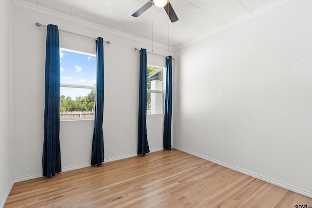 4456 Fm 2767, Tyler, TX 75708 - spare room featuring light wood finished floors, a ceiling fan, ornamental molding, and baseboards