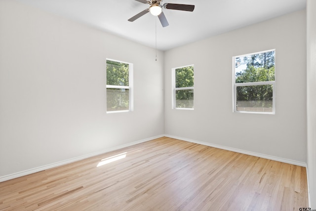 4456 Fm 2767, Tyler, TX 75708 - spare room with wood finished floors, baseboards, and a ceiling fan