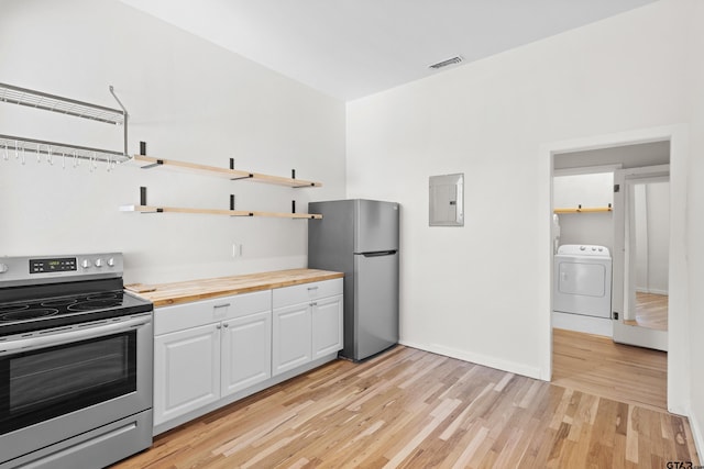 4456 Fm 2767, Tyler, TX 75708 - kitchen featuring wood counters, open shelves, stainless steel appliances, white cabinets, and washer / clothes dryer