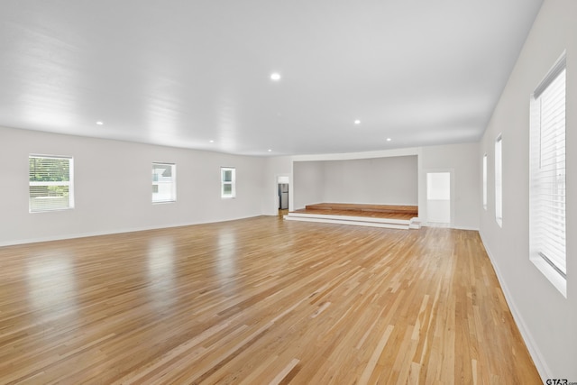 4456 Fm 2767, Tyler, TX 75708 - unfurnished living room with light wood-type flooring, baseboards, and recessed lighting