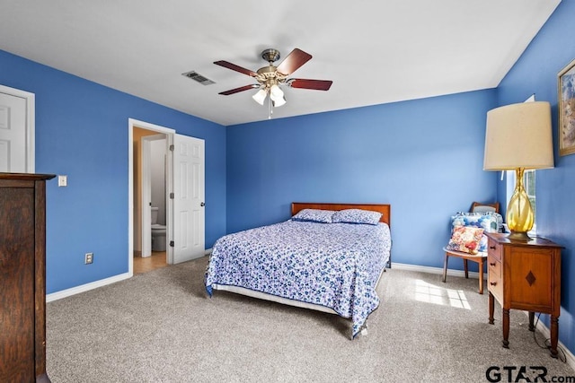 carpeted bedroom featuring visible vents, ceiling fan, and baseboards