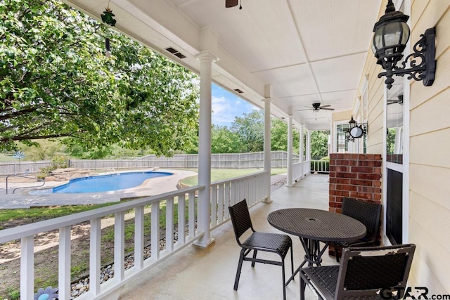 view of patio featuring fence, a ceiling fan, and a fenced in pool