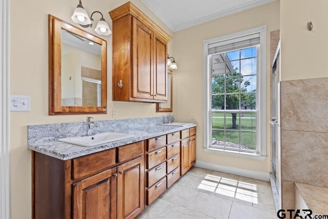full bathroom with crown molding, a shower with shower door, double vanity, and a sink