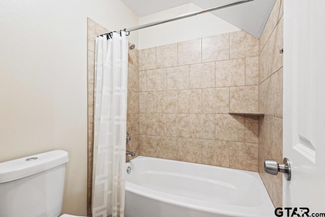 bathroom featuring shower / bath combo and toilet