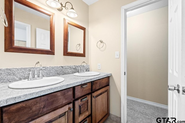 full bath featuring double vanity and a sink