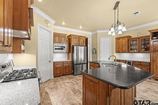 kitchen with brown cabinets, stainless steel appliances, backsplash, and a sink