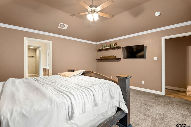 carpeted bedroom featuring lofted ceiling, connected bathroom, crown molding, and ceiling fan