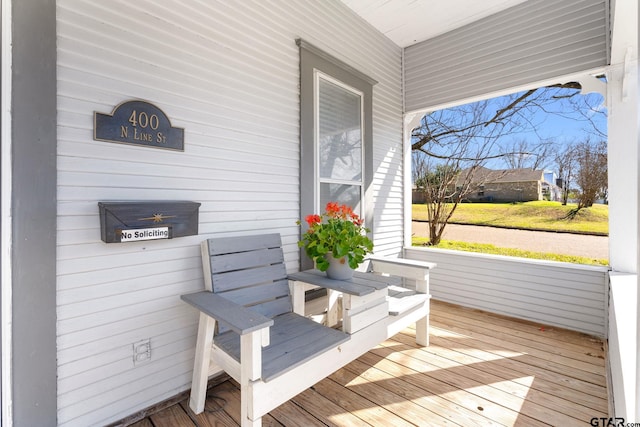 wooden terrace featuring a porch