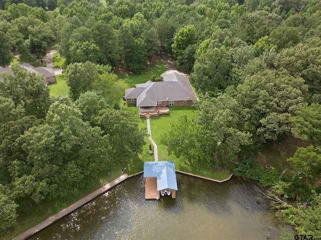 345 Bass Creek Trl, Mount Pleasant, TX 75455 - aerial view of property and surrounding area featuring a nearby body of water and a heavily wooded area