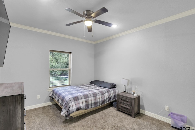 carpeted bedroom featuring ceiling fan and crown molding