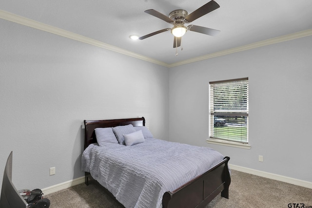 carpeted bedroom with ceiling fan and ornamental molding