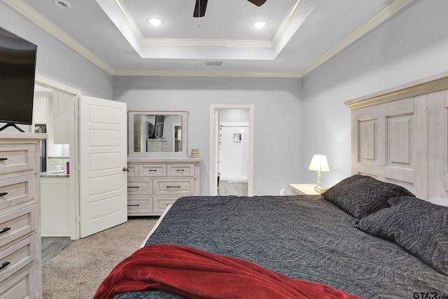 bedroom with a raised ceiling, ceiling fan, and crown molding