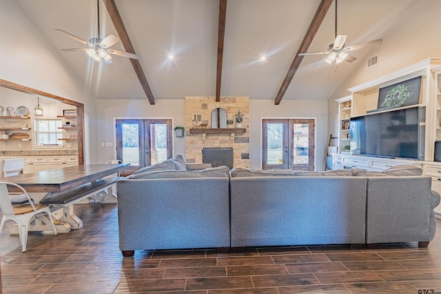 living room with a ceiling fan, high vaulted ceiling, and wood tiled floor