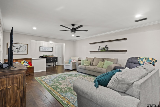 living room featuring dark wood-type flooring, ceiling fan, and ornamental molding