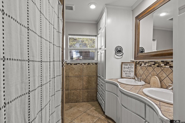 bathroom featuring crown molding, vanity, tile patterned flooring, and tile walls