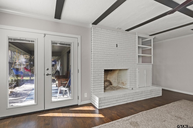 unfurnished living room featuring dark hardwood / wood-style flooring, a brick fireplace, crown molding, and french doors