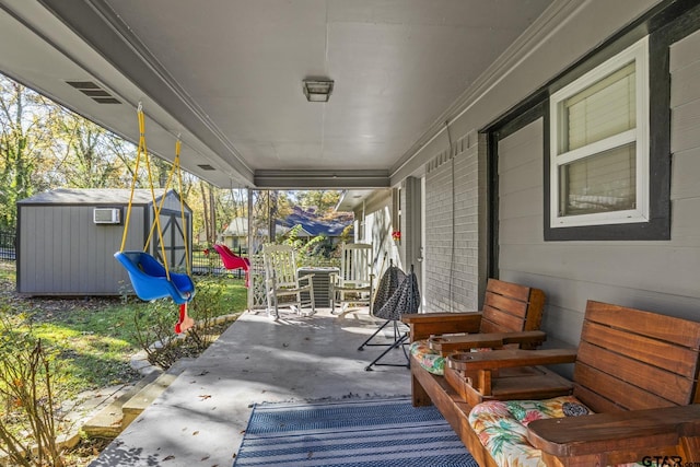 view of patio featuring a storage unit and a playground