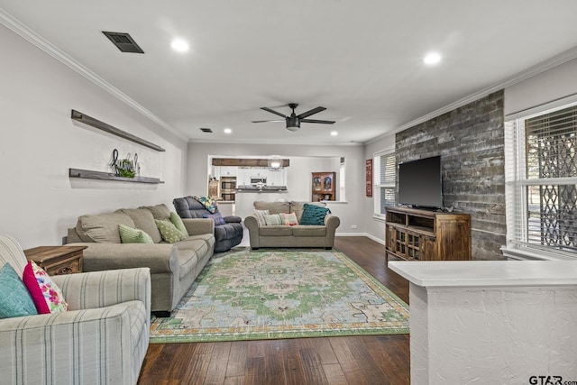 living room featuring crown molding, ceiling fan, and dark wood-type flooring