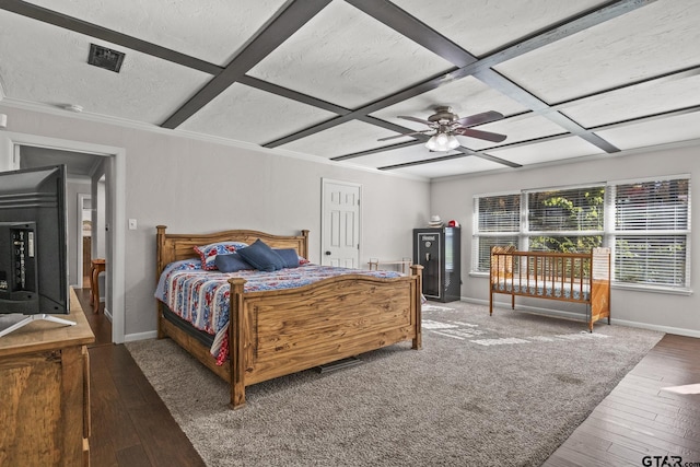 bedroom with crown molding, coffered ceiling, dark hardwood / wood-style flooring, and a textured ceiling