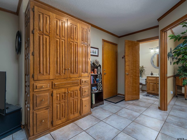 6109 Stoneleigh Dr, Tyler, TX 75703 - interior space featuring crown molding, a textured ceiling, and light tile patterned floors