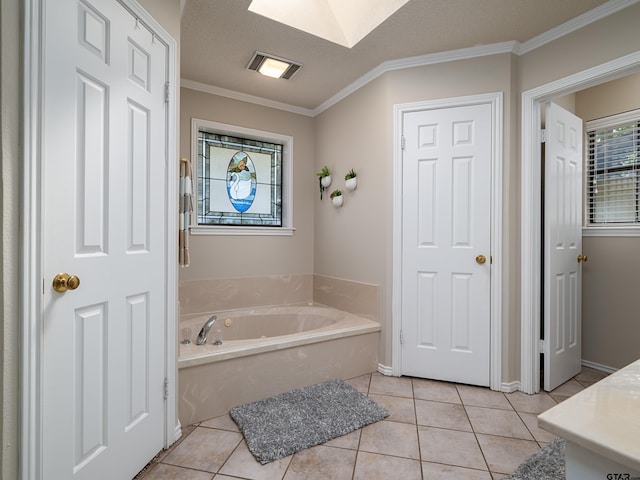 6109 Stoneleigh Dr, Tyler, TX 75703 - bathroom with tile patterned floors, a bath, a skylight, and ornamental molding