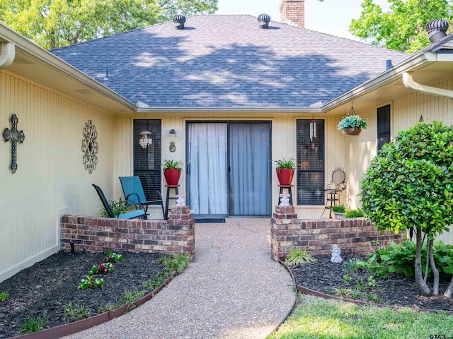 6109 Stoneleigh Dr, Tyler, TX 75703 - doorway to property with roof with shingles and a chimney