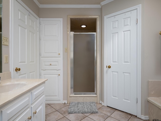 6109 Stoneleigh Dr, Tyler, TX 75703 - bathroom with a stall shower, crown molding, vanity, and tile patterned floors