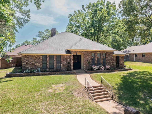 6109 Stoneleigh Dr, Tyler, TX 75703 - single story home with fence, brick siding, a front lawn, a chimney, and a shingled roof