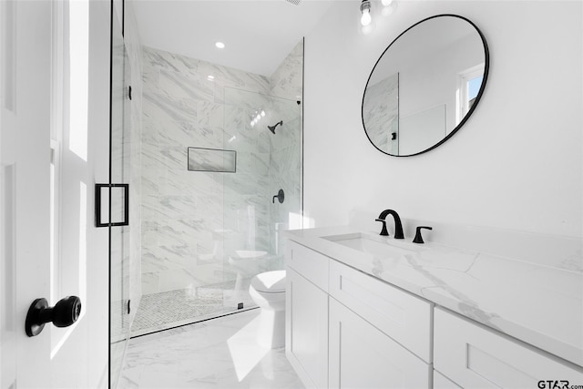 bathroom with vanity, toilet, and an enclosed shower