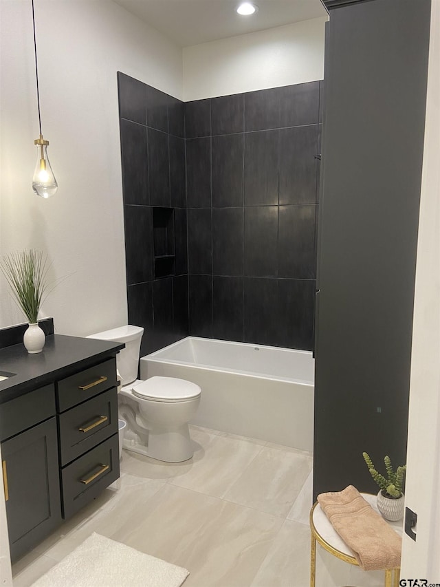 full bathroom featuring vanity, toilet, and tiled shower / bath combo