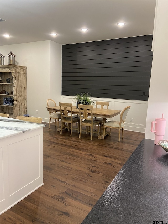 dining area with dark hardwood / wood-style floors