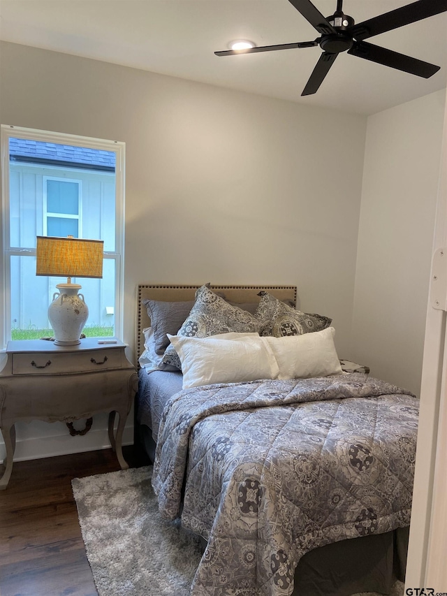 bedroom with ceiling fan and hardwood / wood-style floors