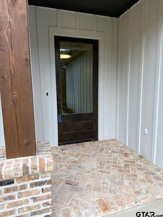 entryway featuring dark hardwood / wood-style floors and a raised ceiling