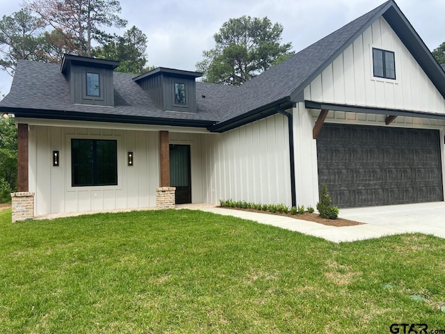 modern farmhouse with a garage and a front yard