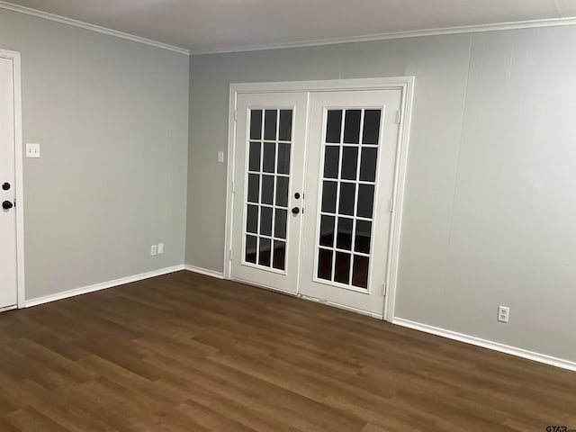 unfurnished room featuring dark hardwood / wood-style flooring, crown molding, and french doors