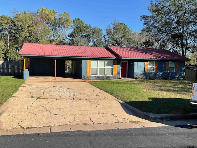 ranch-style home with a front lawn and a carport