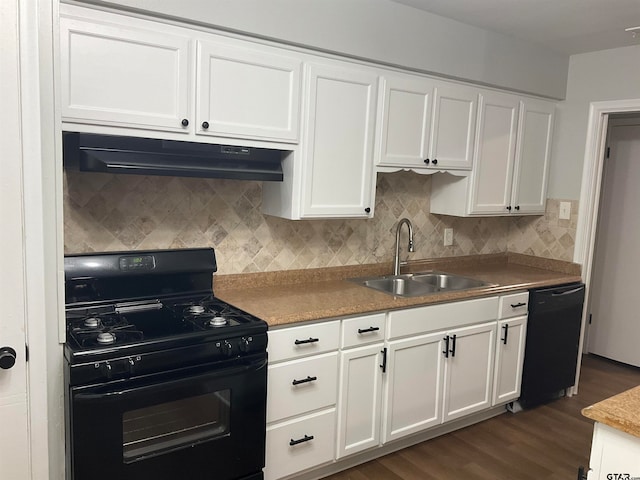 kitchen with dark wood-type flooring, white cabinetry, sink, and black appliances