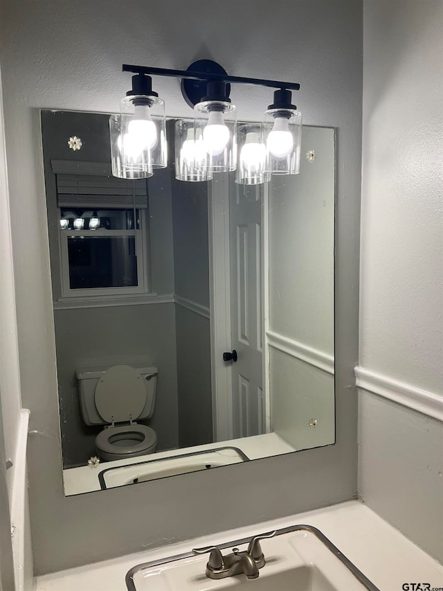 bathroom with sink and toilet