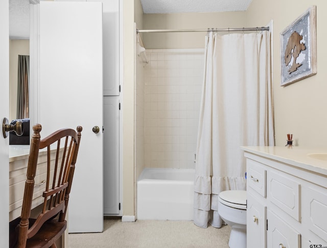 full bathroom with vanity, a textured ceiling, shower / bath combination with curtain, and toilet