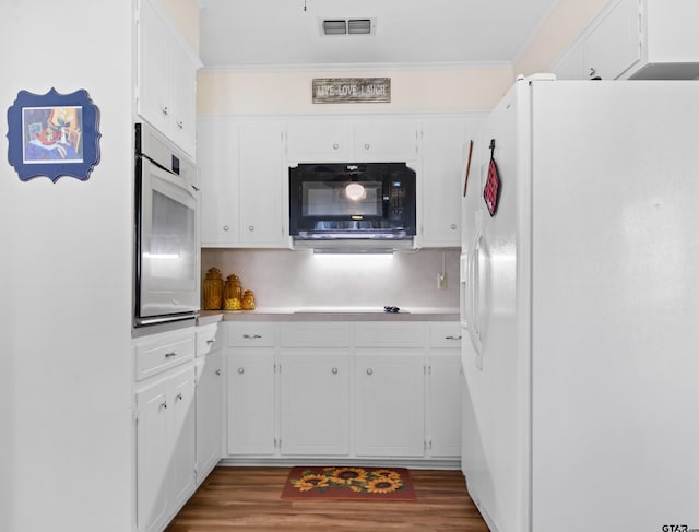 kitchen with crown molding, dark wood-type flooring, white cabinets, and black appliances