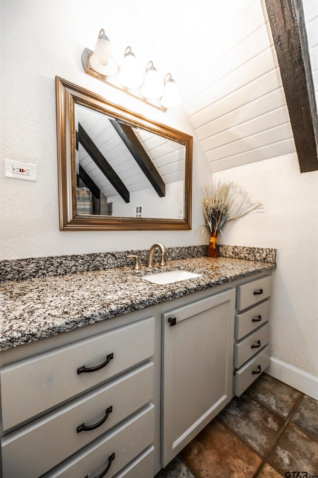 bathroom featuring vaulted ceiling with beams, vanity, and wooden ceiling