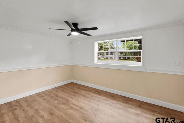 2442 E Devine, Tyler, TX 75701 - unfurnished room with baseboards, wood finished floors, ornamental molding, and a ceiling fan
