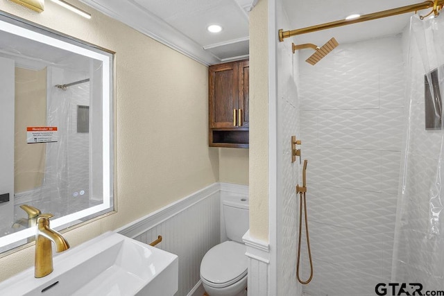 2442 E Devine, Tyler, TX 75701 - bathroom featuring toilet, a shower with curtain, a wainscoted wall, crown molding, and vanity