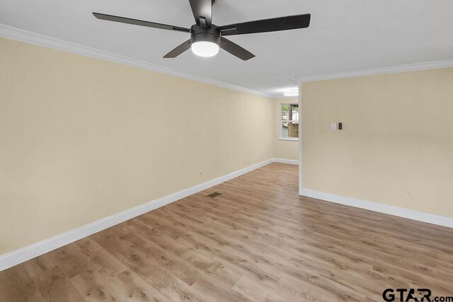2442 E Devine, Tyler, TX 75701 - unfurnished room with crown molding, baseboards, light wood-type flooring, and ceiling fan