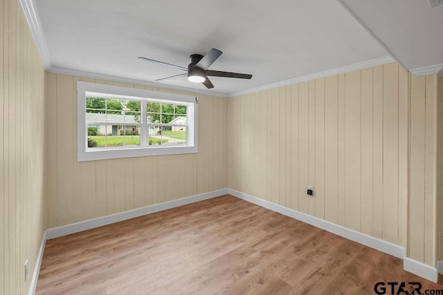 2442 E Devine, Tyler, TX 75701 - unfurnished room featuring ceiling fan, light wood-type flooring, crown molding, and baseboards